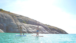 Two people paddling on inflatable SUP