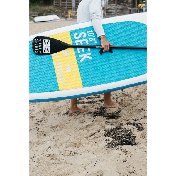 man with 10'8 Seek SUP board
