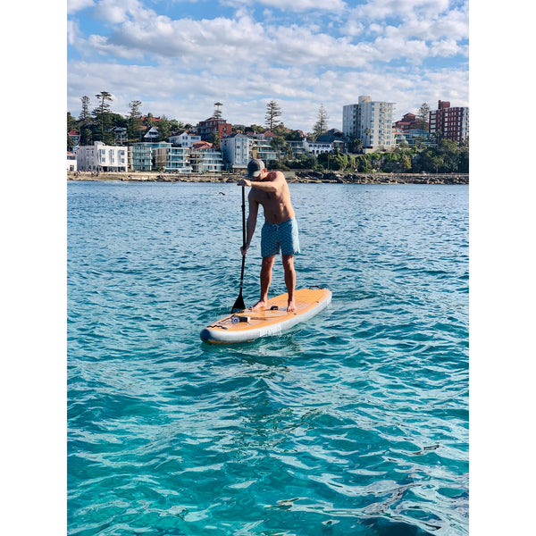 Guy on Bay Sports 11'6 Wood Look Inflatable Stand Up Paddle Board 3