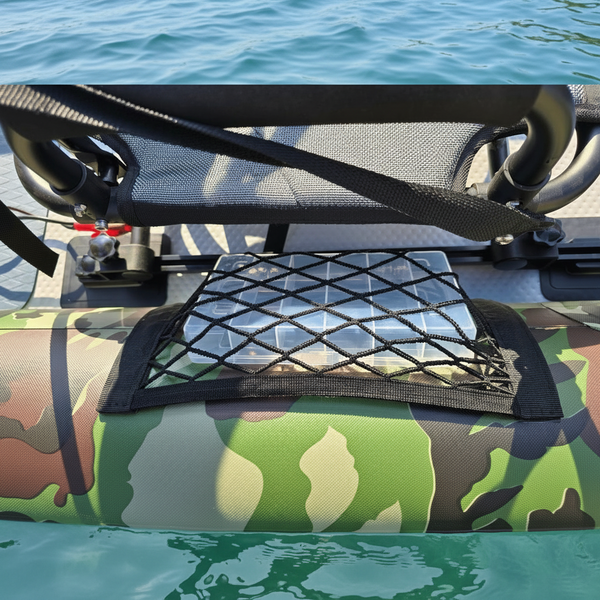 Black mesh cargo net on a camouflage inflatable fishing kayak