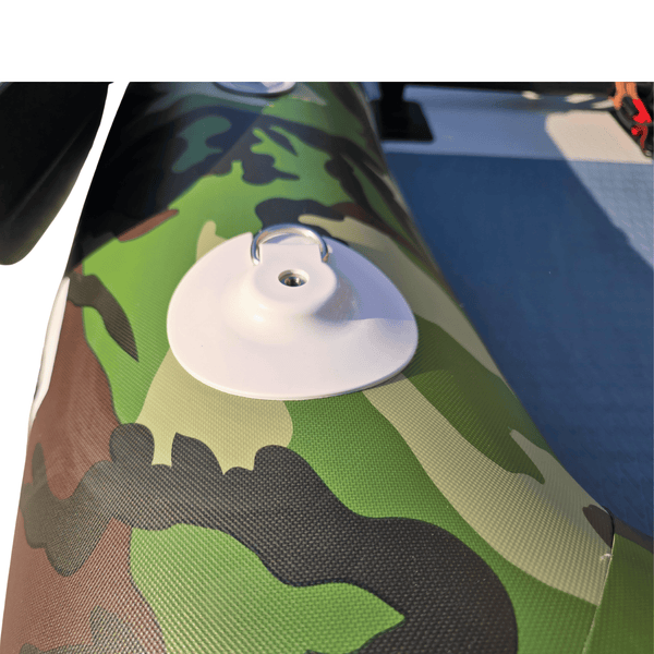 Camouflage-patterned surface with a suction cup on a white background