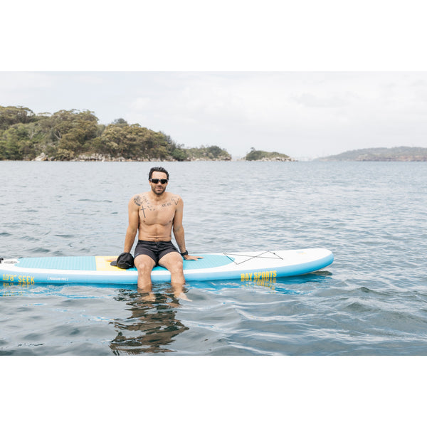 person sitting on 10'8 Seek SUP board