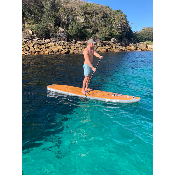 Guy on Bay Sports 11'6 Wood Look Inflatable Stand Up Paddle Board 4