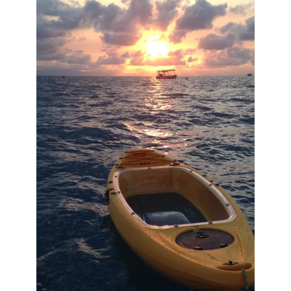 ClearView Clear Bottom Kayak on Water in Yellow Colour